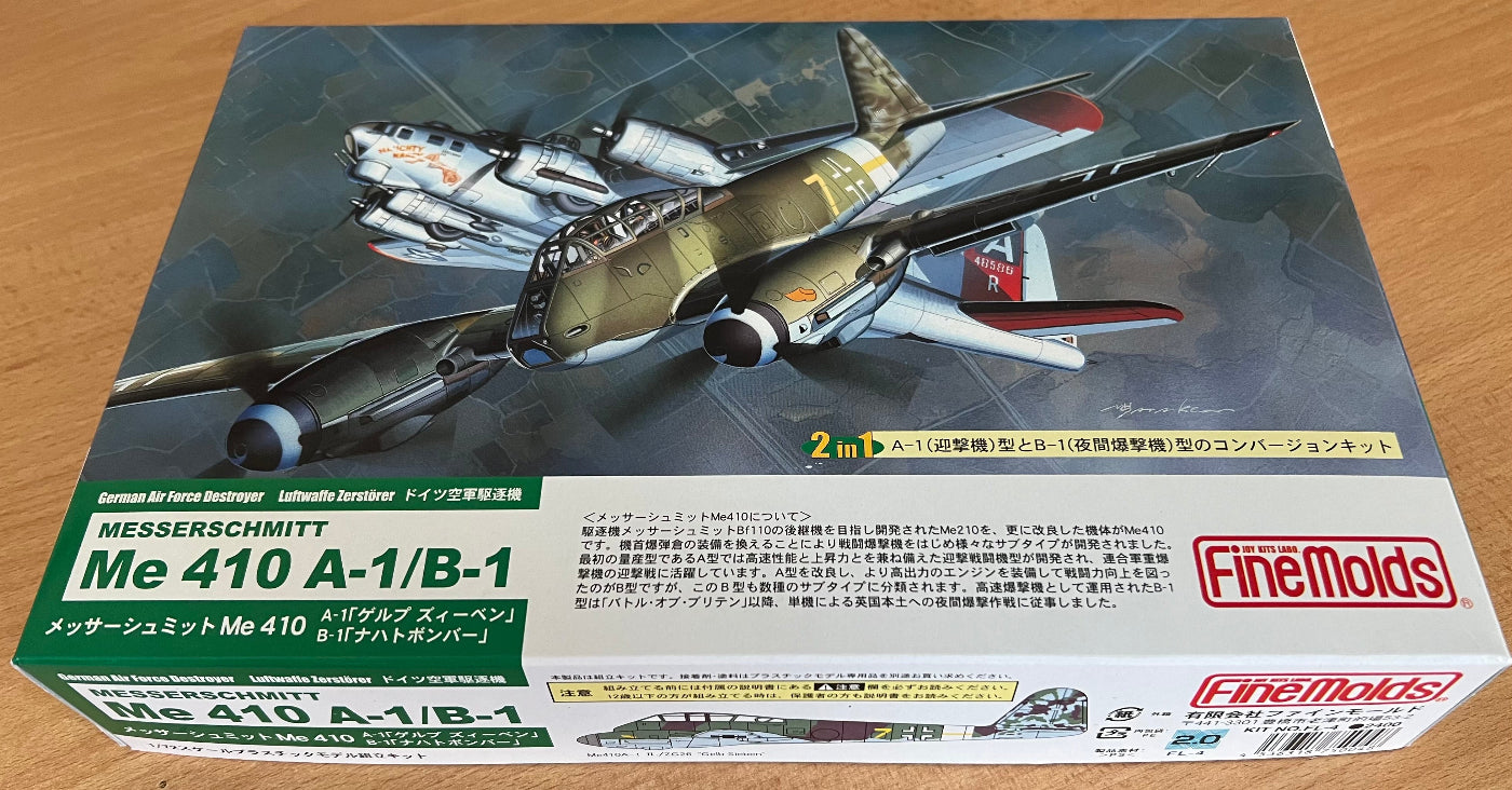 Model airplane kit box for Messerschmitt Me 410 A-1/B-1 on a wooden surface