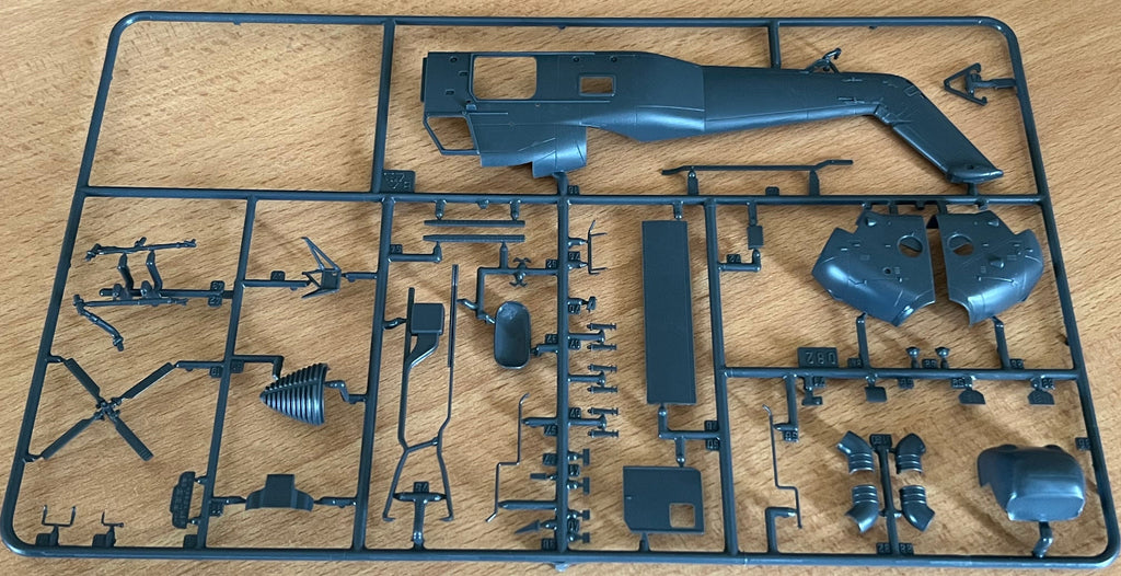 model helicopter parts on a wooden background