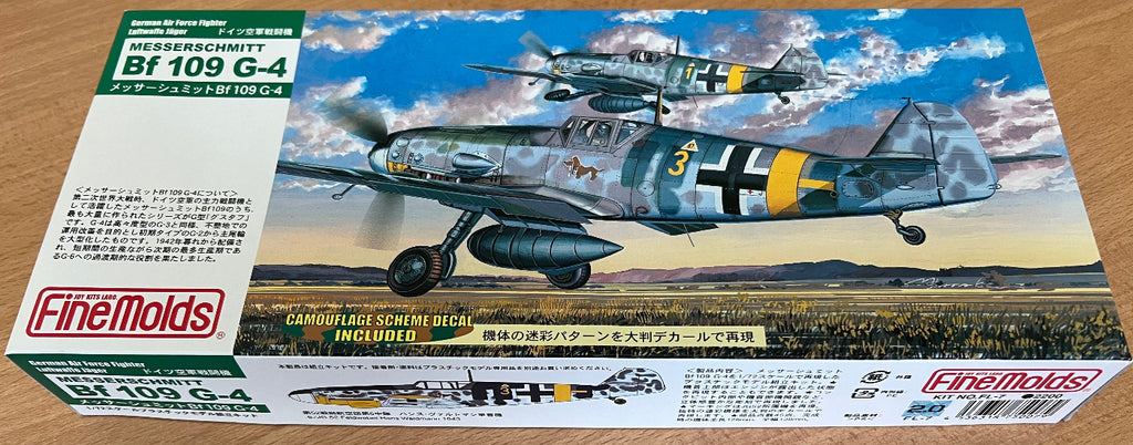 Finemolds Bf109G-4 model box art on a wooden background