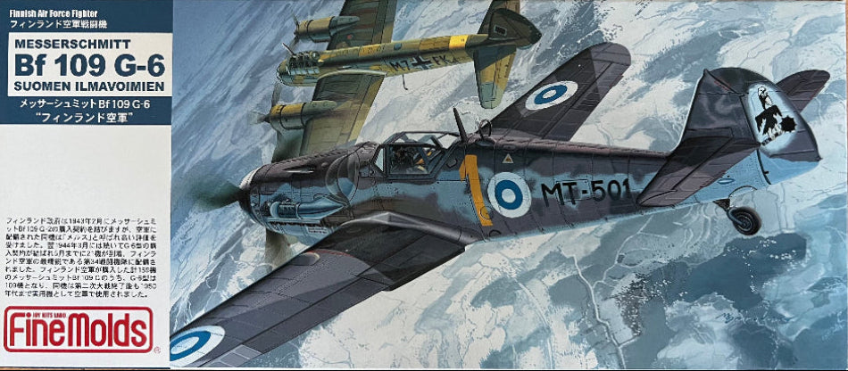 Model airplane kit of a Messerschmitt Bf 109 G-6 with a snowy landscape background.