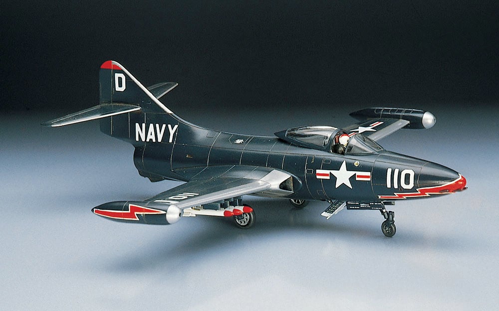 Model of a navy airplane on a gray background