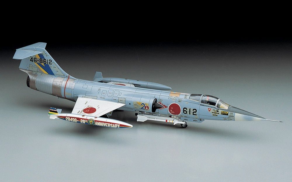 Model of a fighter jet with detailed markings on a gray background