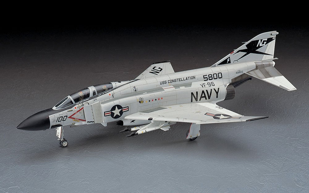 Model of a US Navy fighter jet on a gray background