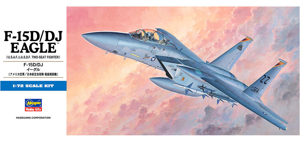 Model kit of an F-15D/DJ Eagle fighter jet against a colorful sky background.