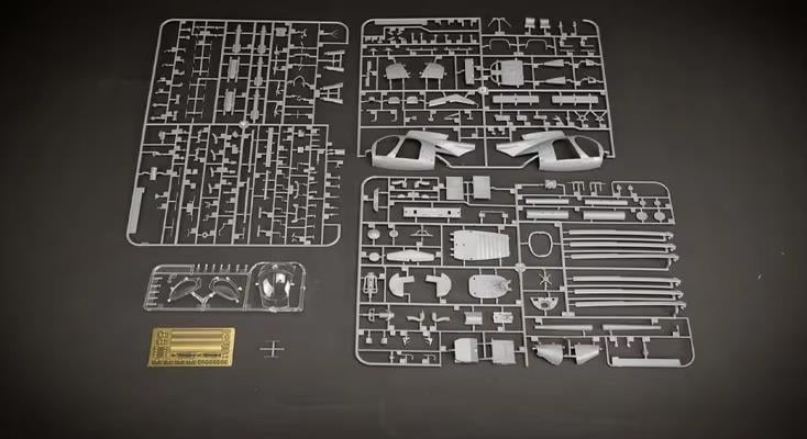 AH-6J kit parts on a gray background