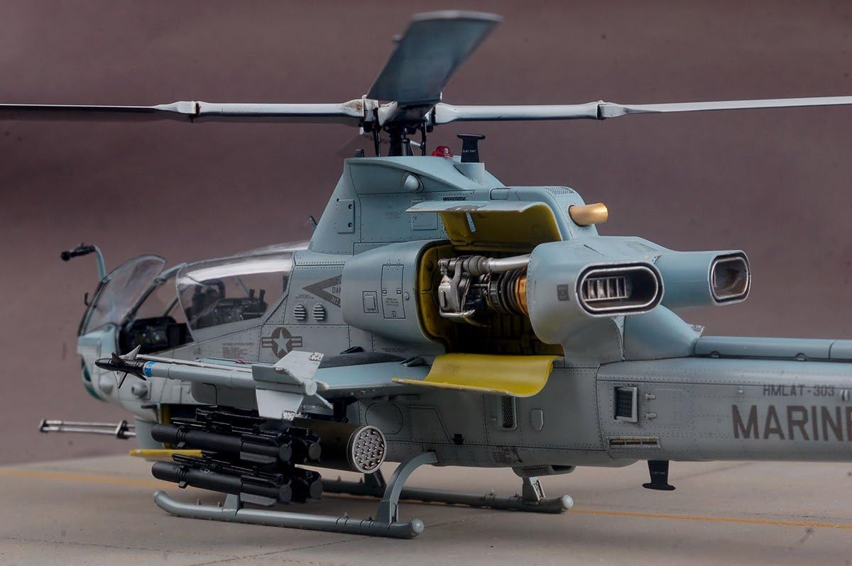 Kitty Hawk AH-1Z Viper model helicopter with open door on a brown background