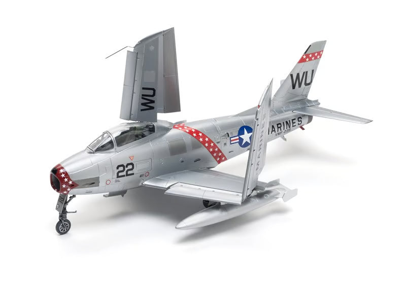 Model airplane with 'WU' and 'Marines' markings on a white background