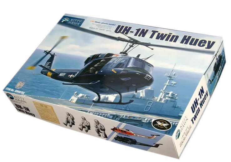 Kitty Hawk model kit of a UH-1N Twin Huey helicopter on a ship with Kitty Hawk branding.
