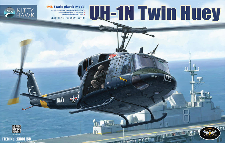 Kitty Hawk model kit of a UH-1N Twin Huey helicopter on a ship with Kitty Hawk branding.