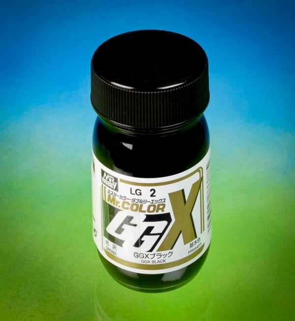 Bottle of Mr. Color GGX Black paint with a gradient blue to green background