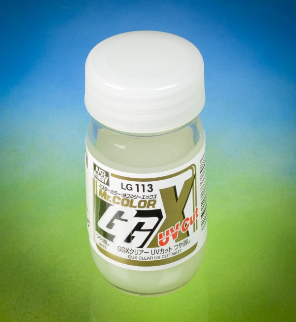 Bottle of Mr. Color GGX UV-Clear with a white cap on a gradient blue to green background