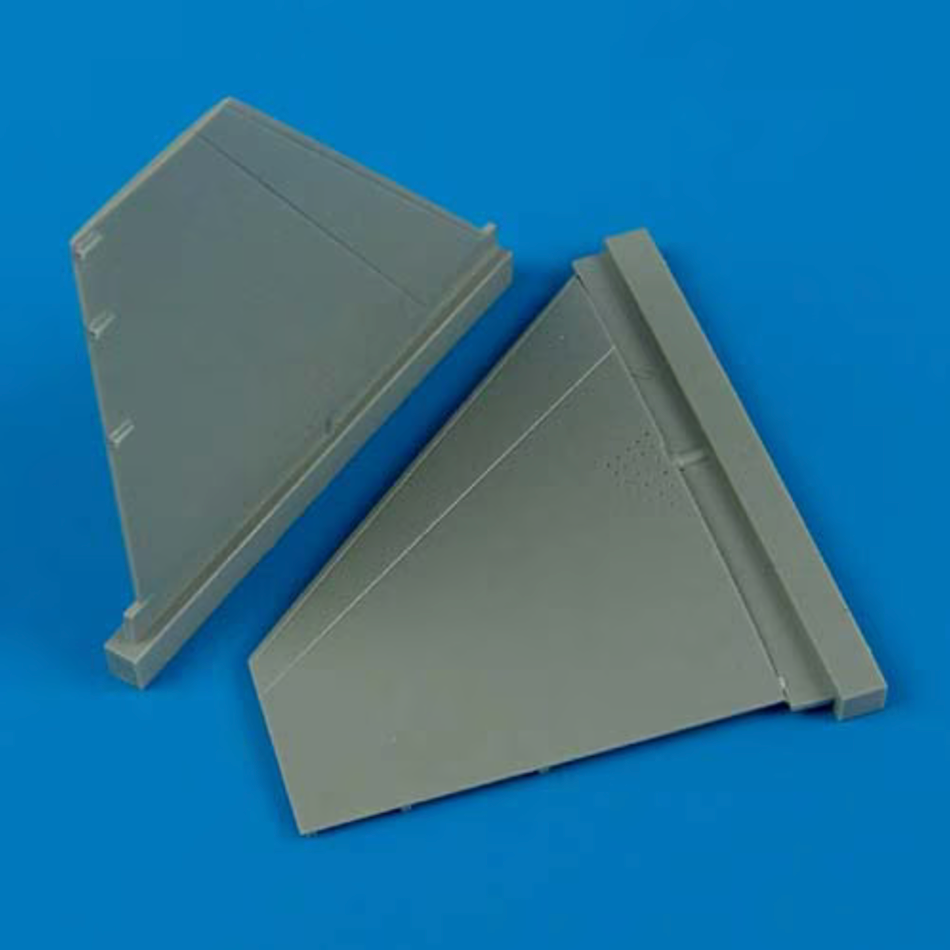Quickboost 1/48 scale gray resin F-16 elevator parts on a blue background