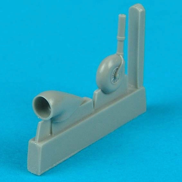 Resin model parts on a blue background