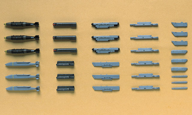 Collection of various tools or components arranged on a beige background
